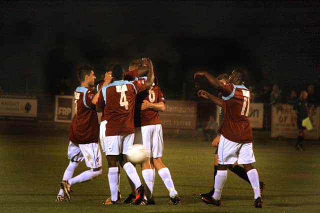 Hastings United celebrate scoring in their 3-0 win at home to Folkestone Invicta on Monday night. Picture by Terry S. Blackman