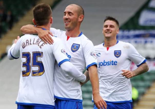 Jed Wallace celebrates his equaliser with Joe Devera and Sonny Bradley. Picture: Joe Pepler