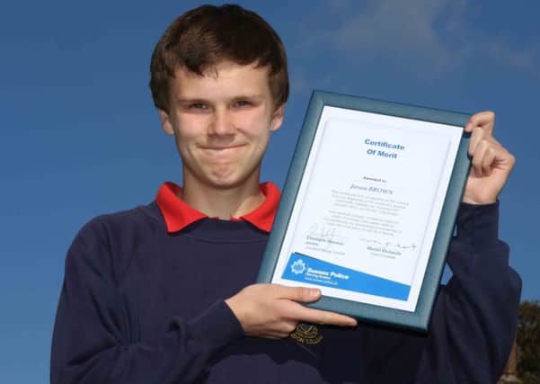 Jason Brown with his certificate of merit
