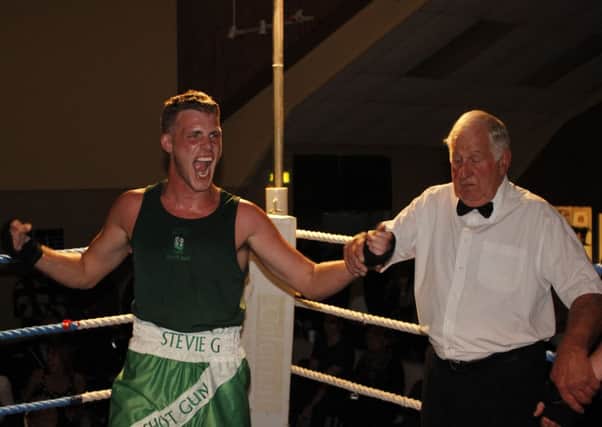 West Hill boxer Steve Garlick celebrates after winning his bout