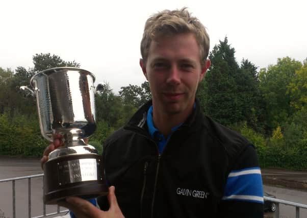 Ben Evans with the Sardinia Open winner's trophy. Picture by Simon Newstead