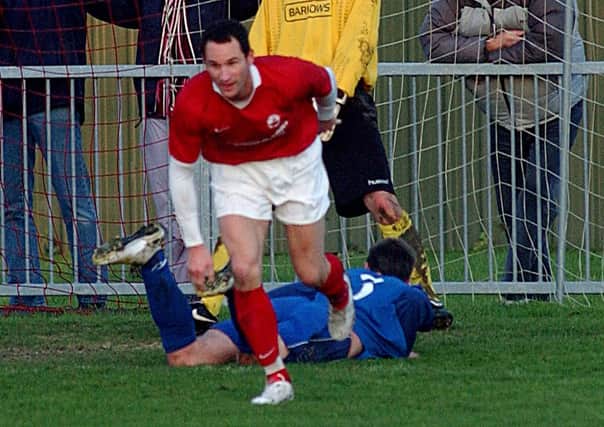 Russell Hardwell celebrates scoring a goal for Arundel in 2009