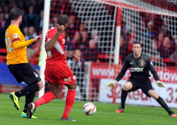 Emile Sinclair scores Crawley's goal during their 1-0 win against Bradford City