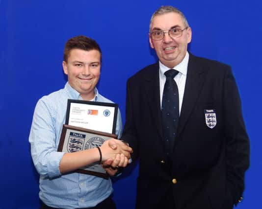 Selseys Matthew Weller receives his award from FA council member Tony Kybett