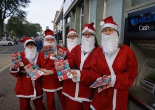 Staff from Barclays branches in Worthing, Rustington and Goring are taking part in the St barnabas House hospice Wear a Santa Suit day
