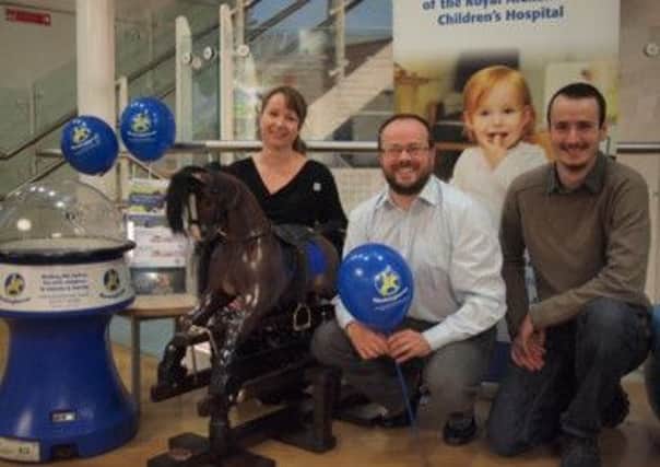 Debbie and Robbie from Jolly Rockers and Ryan Heal Chief Executive of Rockinghorse at the Royal Alexandra Childrens Hospital