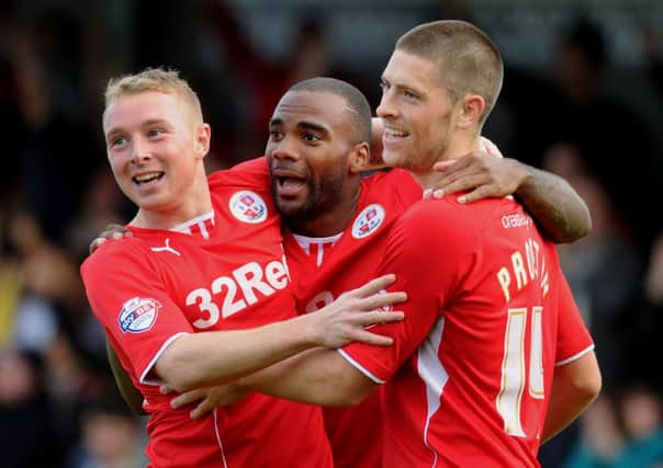 Emile Sinclair celebrates his winning goal against Bradford with Jamie Proctor and Nicky Adams