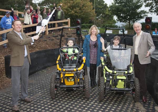 Nick Herbert MP, with young visitors in the new Terrain Hoppers, and Andrew Vivian Chairman of the Trustees. Photograph by Graham Franks Photography