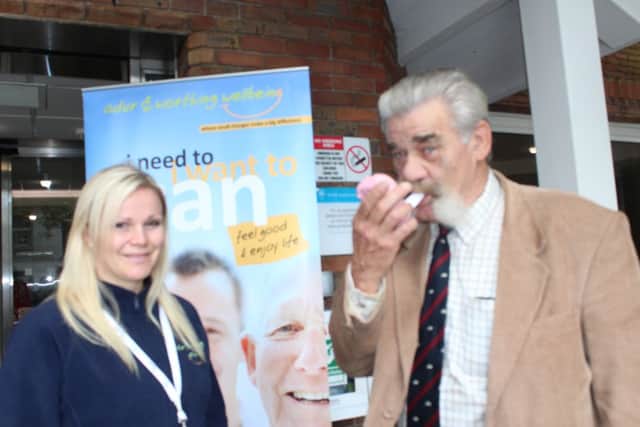 Tom Wye, who has given up smoking for Stoptober, gets a carbon monoxide breath test from Nicole Coleman, wellbeing advisor at the Adur and Worthing Wellbeing Hubs.