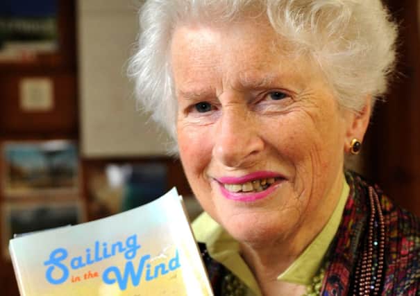 Sally Williams with self-published book. Pic Steve Robards