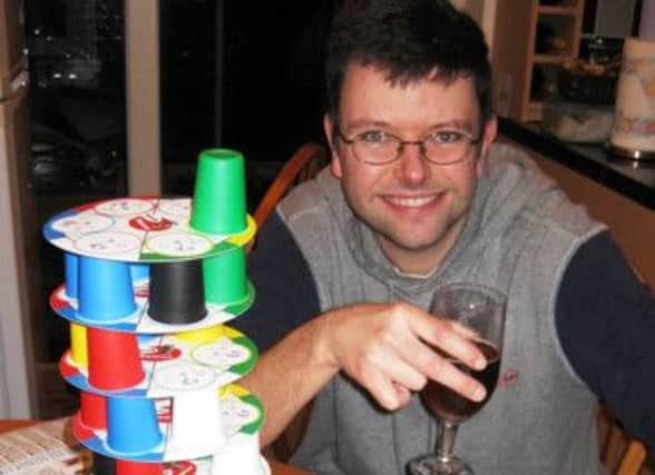 Tim Short toasts his success with his board game Trivia Tower in the Dad's Choice Awards