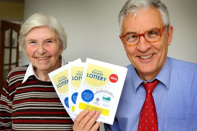 Margaret Ford (chair of Hassocks Amenity Association) and Bob Kenhard (treasurer) promote the Hassocks Village Lottery. Pic Steve Robards