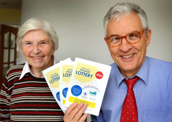 Margaret Ford (chair of Hassocks Amenity Association) and Bob Kenhard (treasurer) promote the Hassocks Village Lottery. Pic Steve Robards