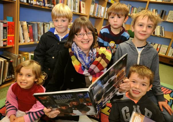 Children enjoy a Dr Who session at Haywards Heath Library with Jill Beese. Pic Steve Robards
