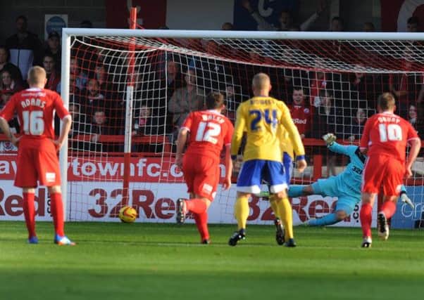 Paul Jones is beaten from the penalty spot as Brentford take the lead against Crawley Town (Pic by Jon Rigby)