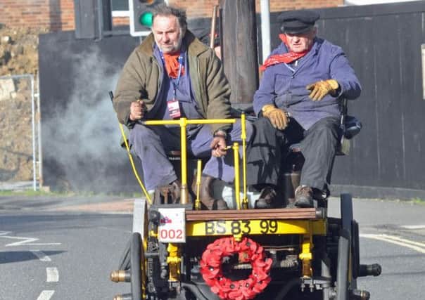 Smokey trip for these entrants in the Veteran Car Run at Burgess Hill this afternoon. pic Phil Dennett