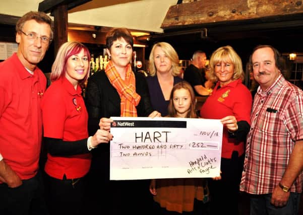Henfield HART responders receive a cheque from Henfield Arts and Crafts Fayre organisers Tracy Smyth and Julie Mitchell (centre) with Heather Mitchell, aged 9. Picture by Mike Beardall, Oakfield Media