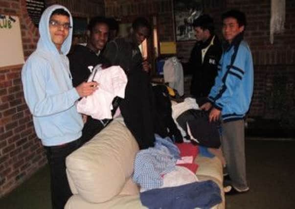 Pestalozzi students with some of the warm winter clothes donated by generous members of the public following an appeal in the Battle Observer.