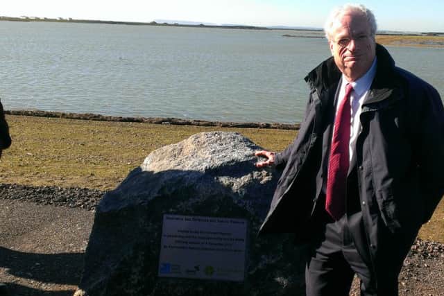 Lord Chris Smith, chairman of the Environment Agency unveils the plaque makring the completion of the Medmerry realignment scheme