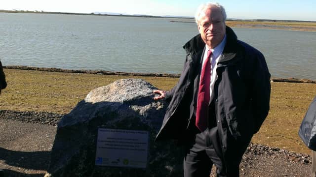 Lord Chris Smith, chairman of the Environment Agency unveils the plaque makring the completion of the Medmerry realignment scheme