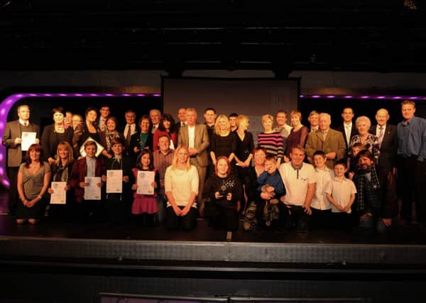 Previous Observer Community award winners.  Photo by Louise Adams  C121773-26