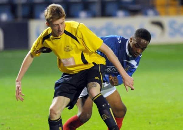 Moneyfields' Liam Kyle and Pompey's Fahad Rwakarambwe battle for the ball at Fratton Park on Tuesday night