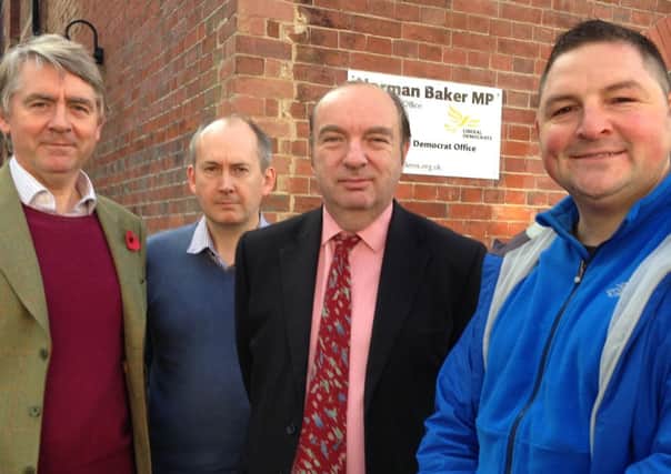 Adam Walker, right, with Norman Baker and other residents
