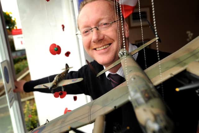Paul Masson Funeral Director with his window dsiplay marking 70 years of RAFA. Pic Steve Robards