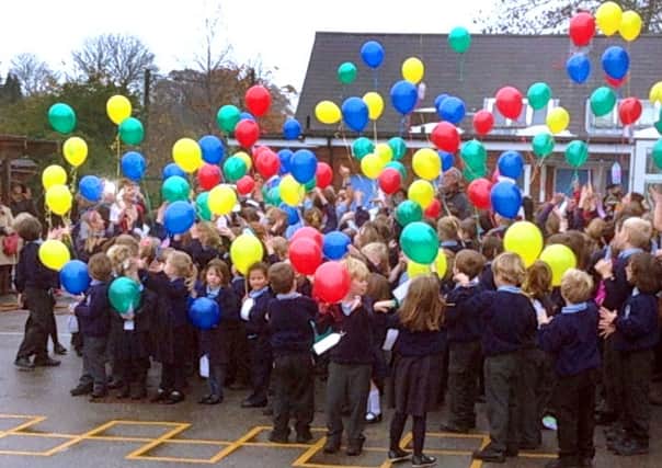Catsfield School release balloons to celebrate their great Ofsted report