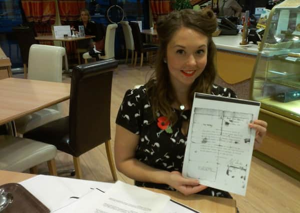 Ella McMhon, 21, who brought her great-grandfather's letters he wrote while imprissoned in a Japanese POW camp