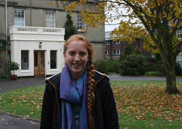 Amy Hoare, Englands top ranked Under 18 female player in front of the Manor House at Farlington School