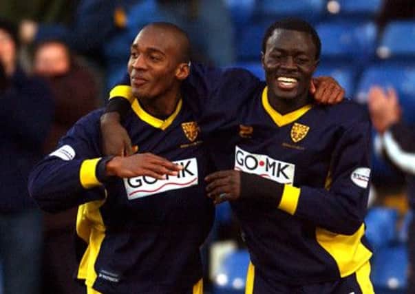 Damien Francis, left, and Patrick Agyemang celebrate a goal during their days at Wimbledon