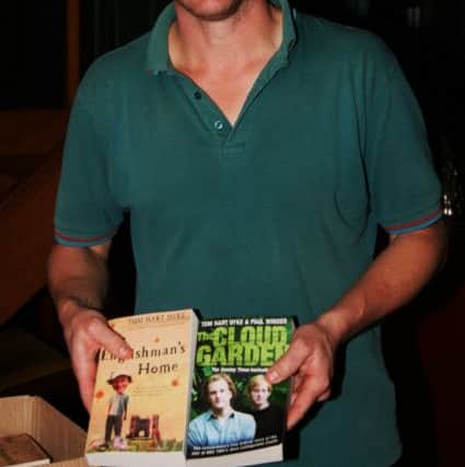 Tom Hart Dyke with his books