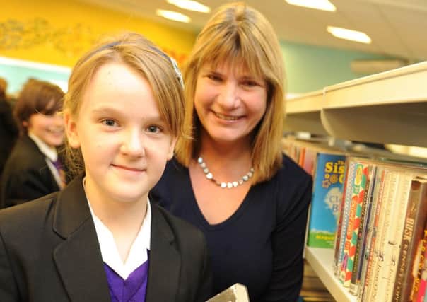 JPMT 151113 Opening of newly designed LRC/Library at St Paul's Catholic College.  Local children's author Jane McLoughlin with pupil Amelia Partridge 12. Photo by Derek Martin