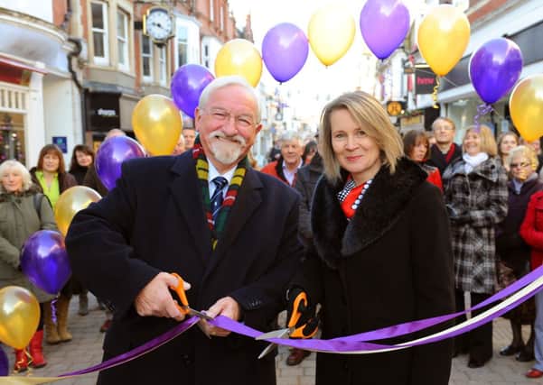 JPCT 161113 Unveiling of changes to Horsham's West Steet and Christmas celebrations. County councillor Brad Watson and Horsham District Councils deputy leader Helena Croft cut the ribbon. Photo by Derek Martin