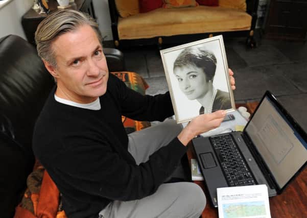 JPCT 141113 Simon Tauber - hoping to set up a fundraising bereavement website. Holding a photo of his mother. Photo by Derek Martin