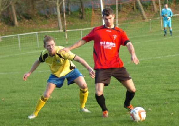 Ben Billings, pictured here against Cove on Saturday, struck twice in Rye United's extra-time victory over Loxwood. Picture by Simon Newstead