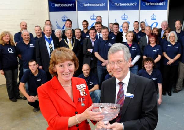 JPCT 171012 Turbosound in Partridge Green presented with Queens Award.  The Lord-Lieutenant Susan Pyper presents a bowl to chairman Philip Hart.  Photo by Derek Martin
