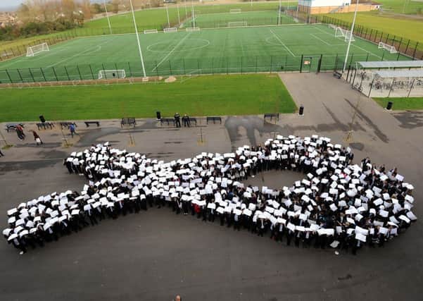 About 549 students from years-seven and eight formed the white ribbon   L48771H13