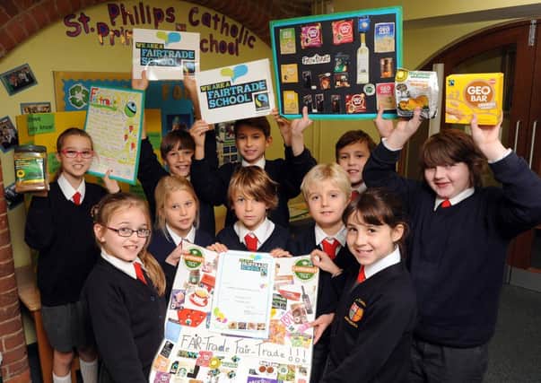 Year-six pupils with celebrate their Fairtrade award                                                                                   L48542H13