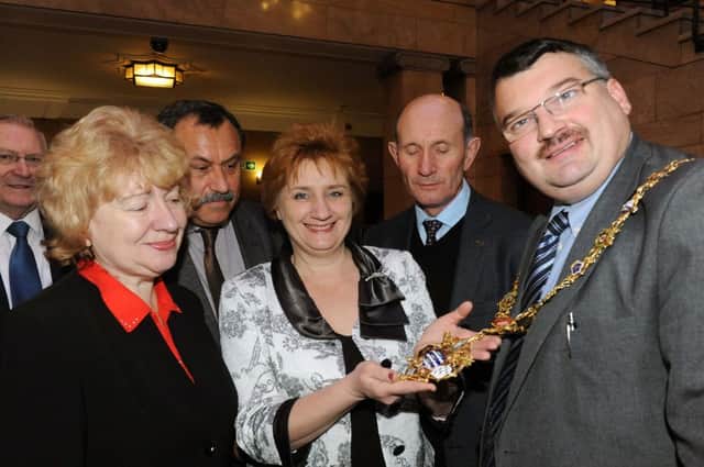 Worthing mayor Bob Smytherman show Russian visitors his mayoral chains 		          W48611H13