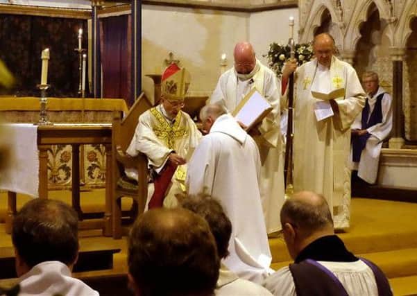 Bishop Martin Warner blesses Winchelsea's new Rector Robin Whitehead