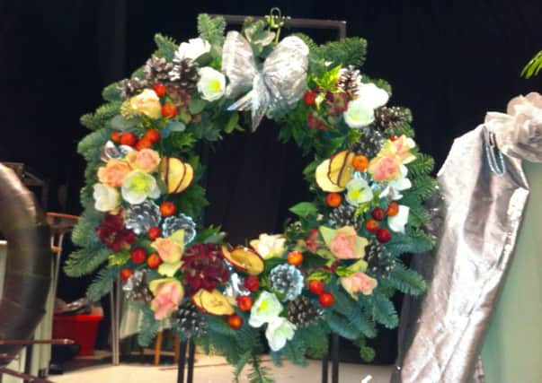 Sedlescombe and District Flower club hosted a special open evening with visiting NAFAS demonstrator Carolyn Meer, who had travelled from Worthing,   to give an inspiring  Christmas floral demonstration last Wednesday.