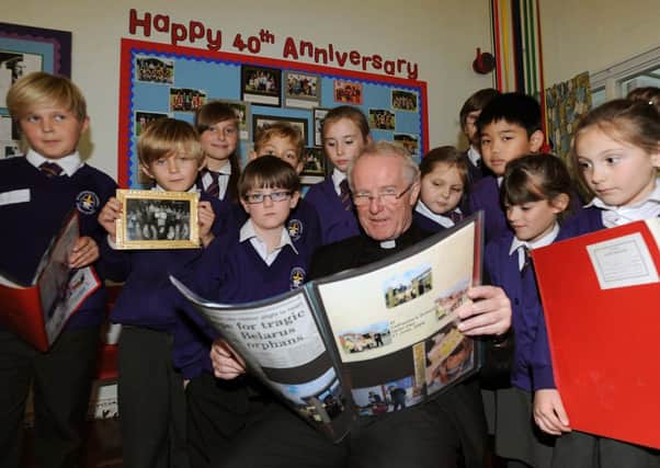 Bishop Kieran Conry celebrates with pupils at St Catherines                      L48791H13