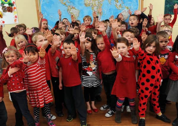 S48634H13 Red clothes symbolised 'stop bullying' at Glebe Primary School on Friday