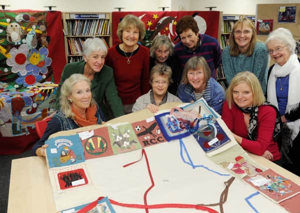 S48652H13

 Quilters with the Heritage Quilt Project panels at Steyning Grammar School's winter fair