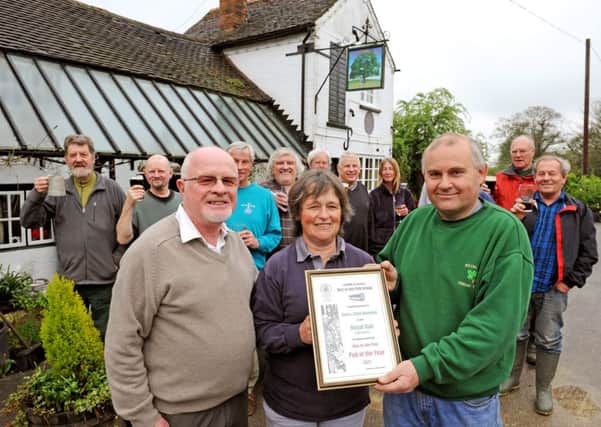 JPCT 030512 Sara and Clive Blunden at the Royal Oak, Rusper, receive CAMRA Pub of the Year award. Photo by Derek Martin