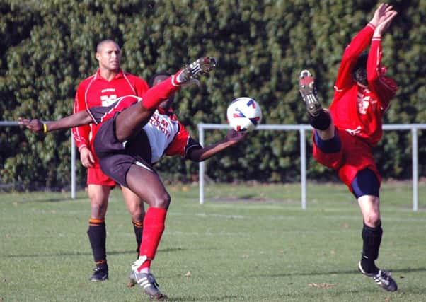Ade Olorunda goes for goal while playing for Rye & Iden United against Redhill in October 2004