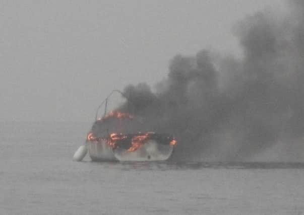 The moment lifeboat crews arrived at a boat blaze off the coast of Littlehampton