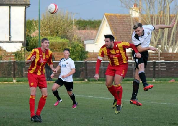 Scorer James Temple gets up well for Pagham against Newhaven  Picture by Roger Smith